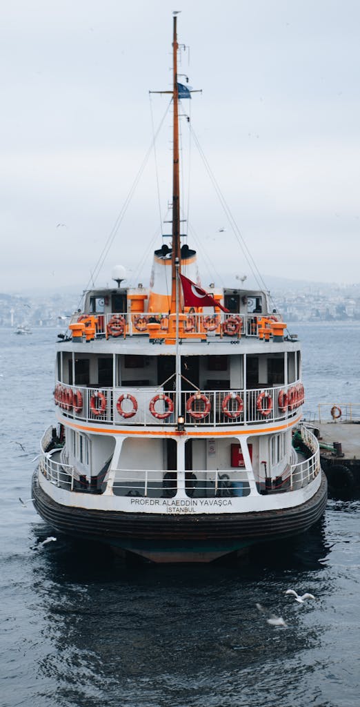 A classic Istanbul ferry docked on the Bosphorus, showcasing a vibrant maritime scene.